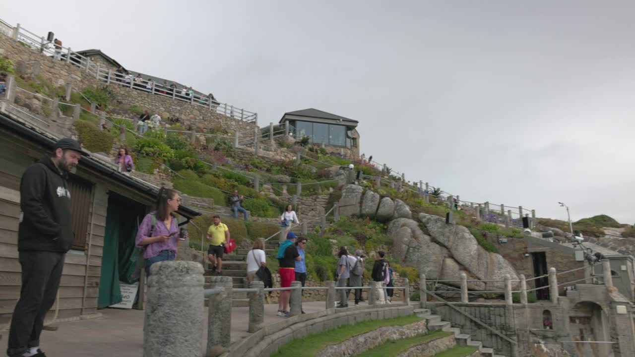 Crowds of people enjoying the scenic hillside garden