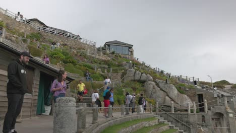 crowds of people enjoying the scenic hillside garden