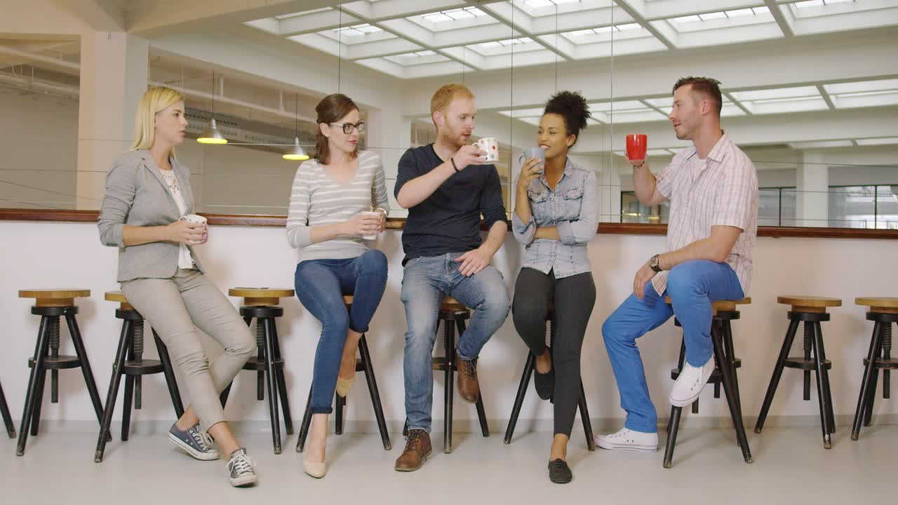 People drinking coffee during break