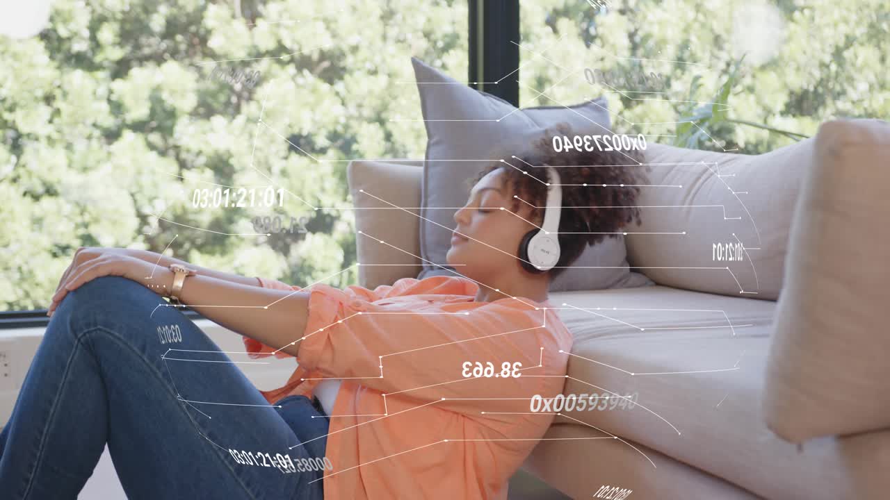 Woman tapping phone by window, showing tech HUD overlays while leaning back, relaxing with headset
