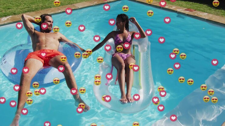 Couple floating on pool floats holding hands, social media engagement rising and hearts multiplying