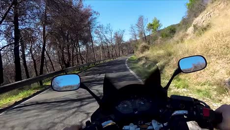 Point-of-View-Riding-a-Black-Motorcycle-on-mountain