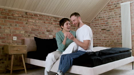 couple talking on the bed