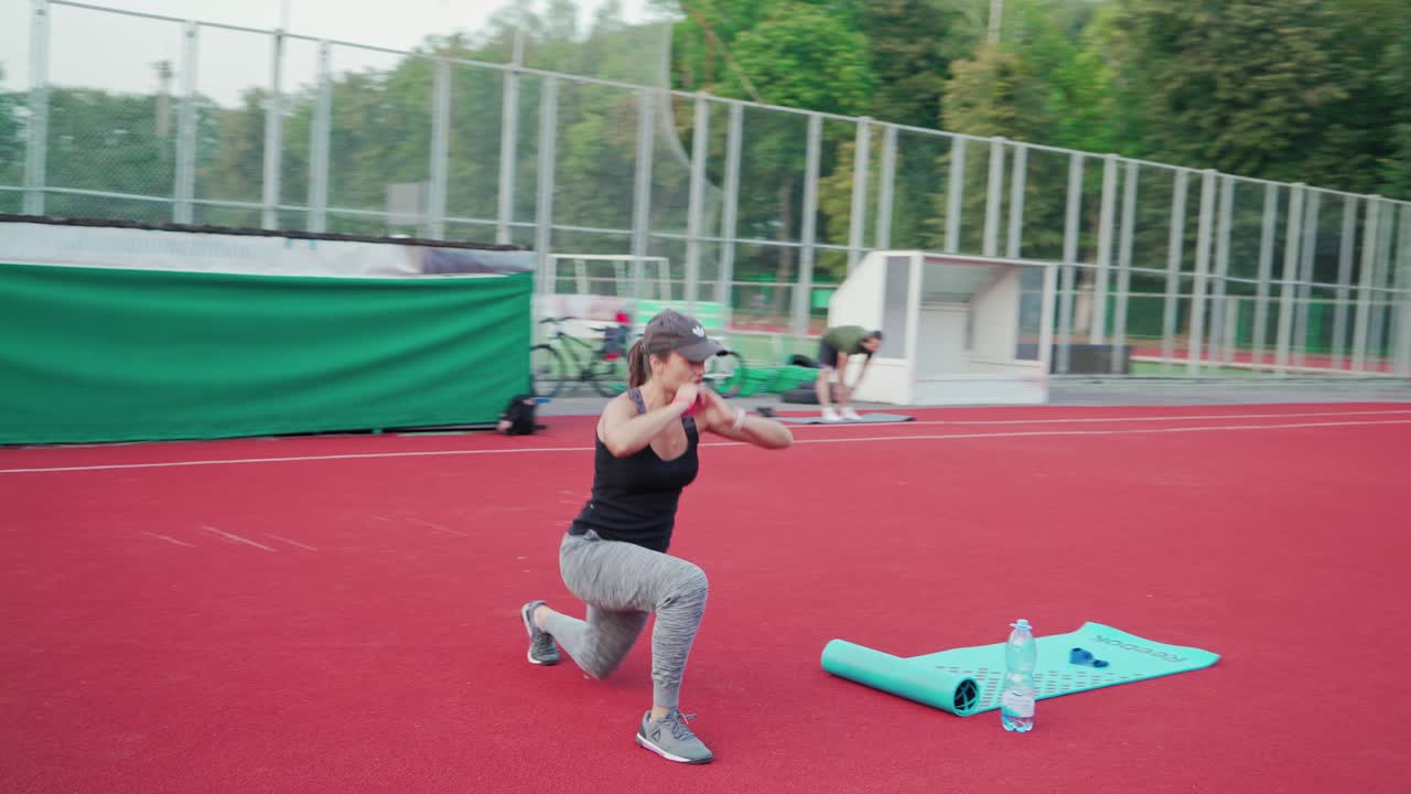 Young people training outdoor. High intensity training workout on stadium