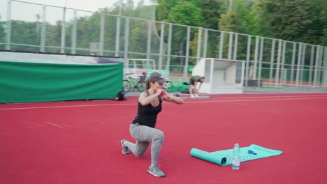 young people training outdoor. high intensity training workout on stadium
