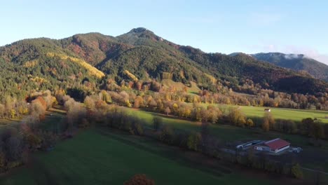 Aerial-view-of-fields-around-the-mountain-town-of-Lenggries-in-Bavaria-during-a-sunny-autumn-day