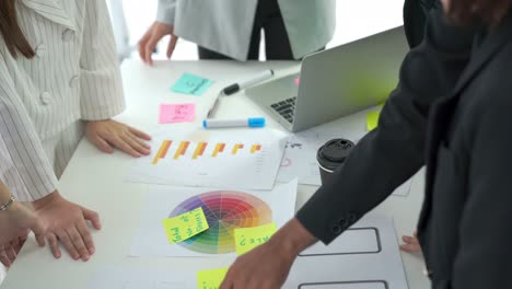 business people proficiently discuss work project on meeting table