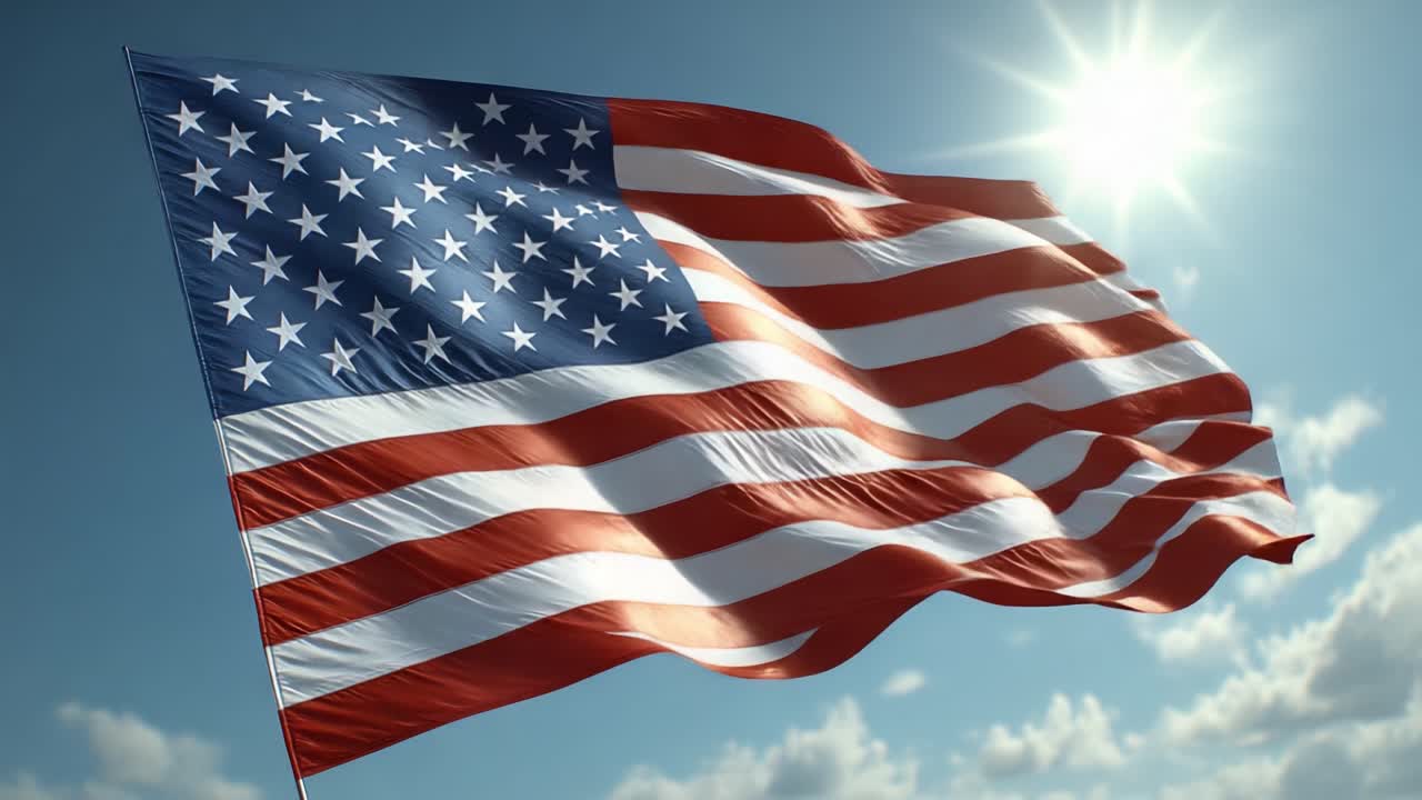 Et amerikansk flag, der vajer majestætisk i brisen mod en lys himmel, symboliserer frihed og patriotisme med solstråler, der oplyser dets farver.
