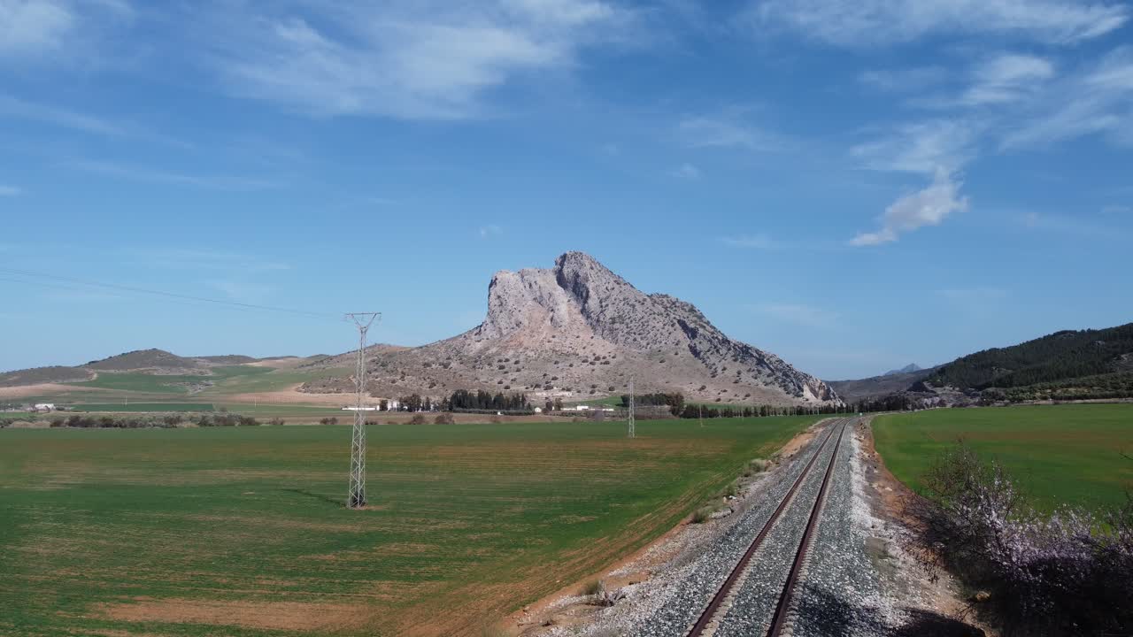 Spectacular aerial flight over the enclave of Pe&ntilde;a de los Enamorados, a rock formation in the shape of a human face in the municipality of Antequera in Andalusia, Spain