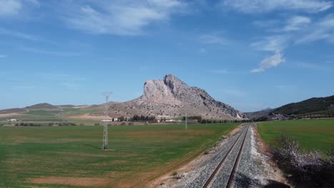 spectacular aerial flight over the enclave of peña de los enamorados, a rock formation in the shape of a human face in the municipality of antequera in andalusia, spain