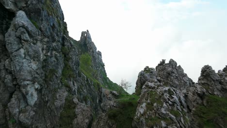 lombardy, italy - a breathtaking vista of the rugged, jagged summit of grignetta - drone flying forward