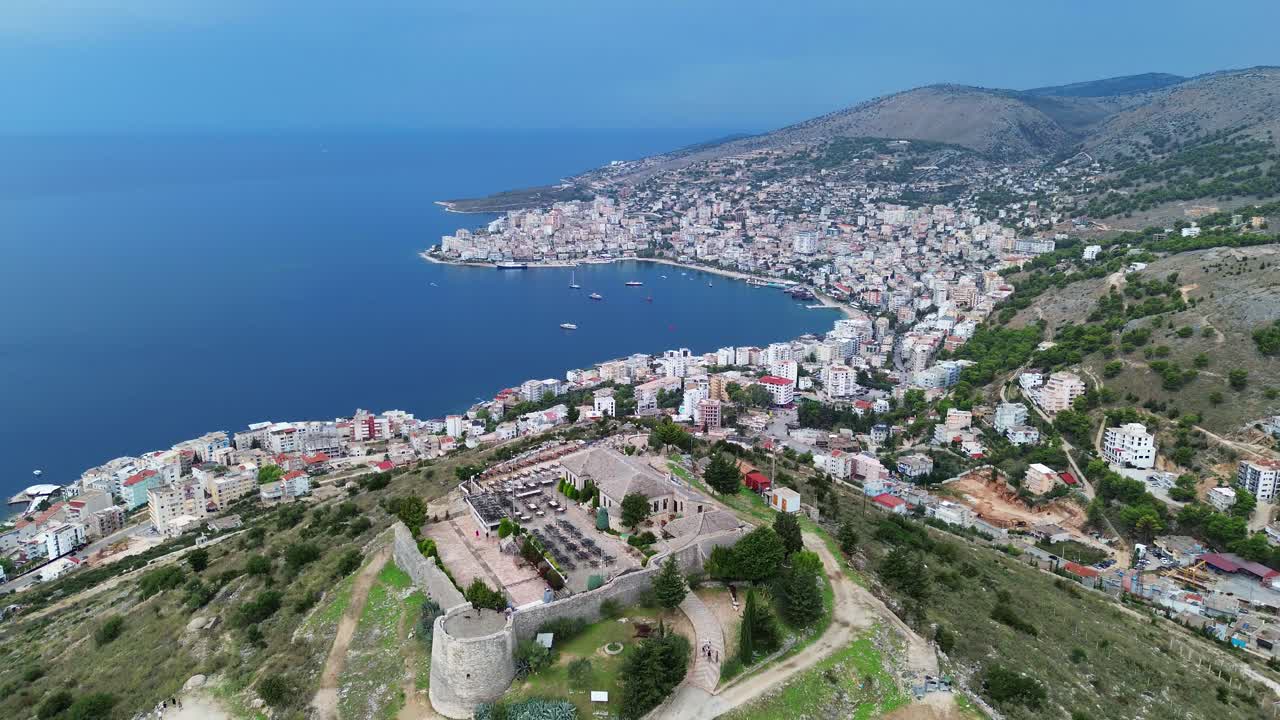 Lekuresi castle ruin Kajala e Lëkurësit Saranda Albania city aerial view