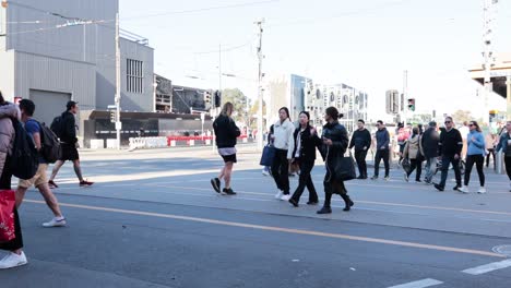 people crossing a street in melbourne, australia