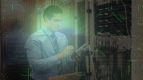 man working in server room and glowing circuit board