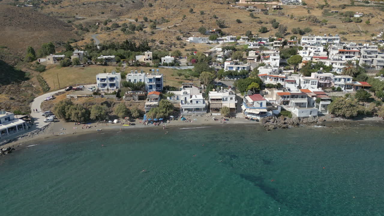 Beachside Community Of Lentas On Island Of Crete Greece Drone Track Back 4K 60FPS
