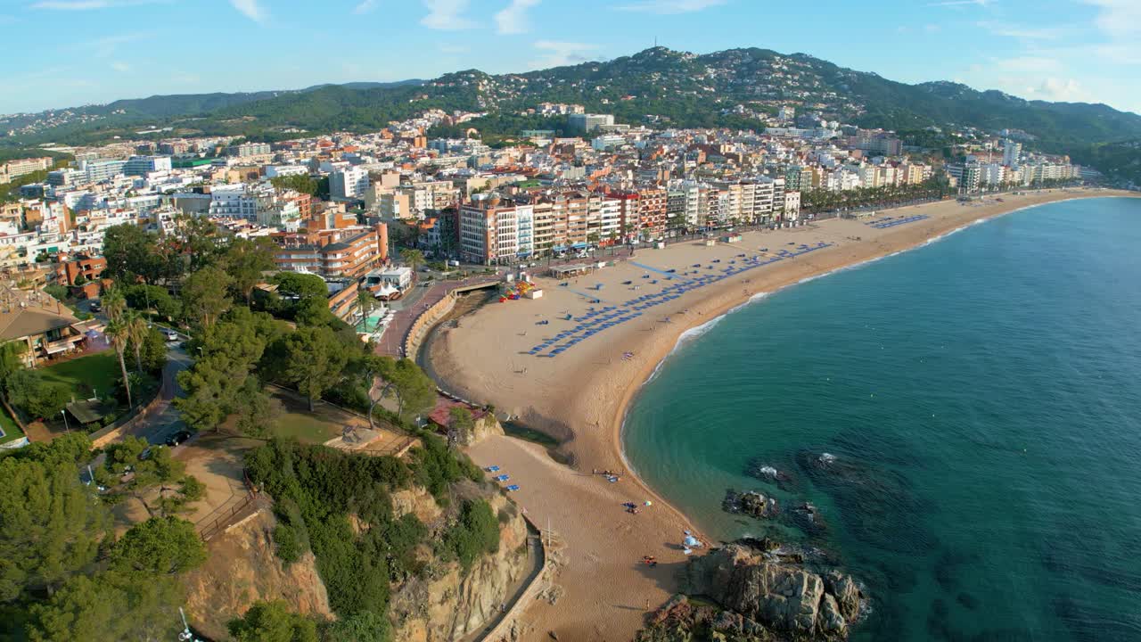 Panoramic view of Lloret De Mar beach on the Costa Brava of Gerona at sunrise golden hour