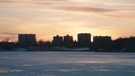 beautiful sunset sky with silhouetted cityscape in sherbrooke, quebec, canada