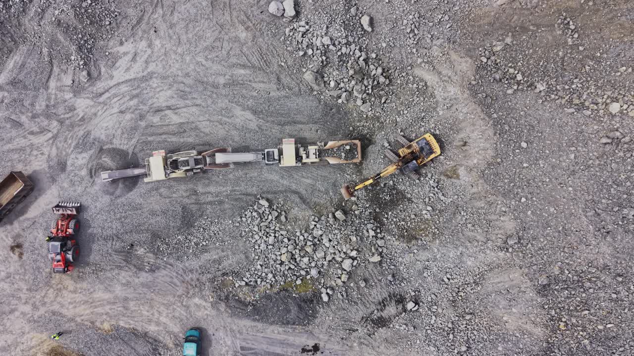 Aerial View of Rock Crushing Machine and Excavator in Quarry