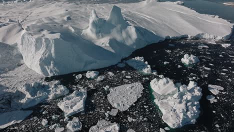 drone over sea and ice of ilulissat icefjord