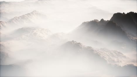 distant mountain range and thin layer of fog on the valleys