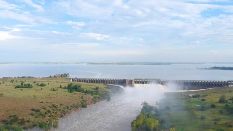 Long-Reservoir-wall-with-sluice-gates-at-Vaaldam-South-Africa,-Drone-Shot