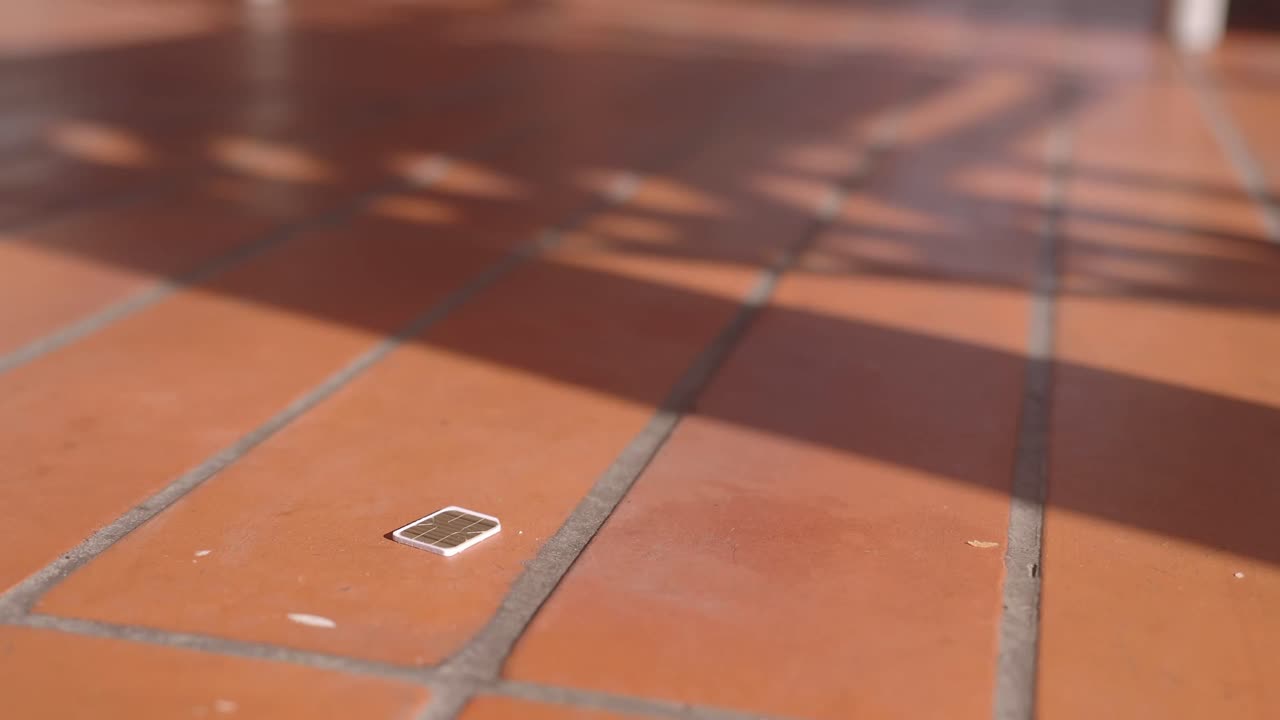 Lost SIM Card on a Patio Floor