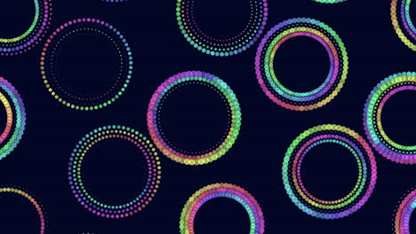 patrón de círculos de neón con arco iris y puntos aleatorios en degradado negro 2