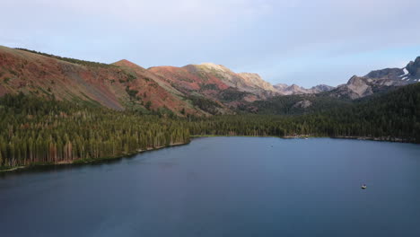 aerial landscape view of a mountain lake surrounded by a pine forest in mammoth lakes, ca