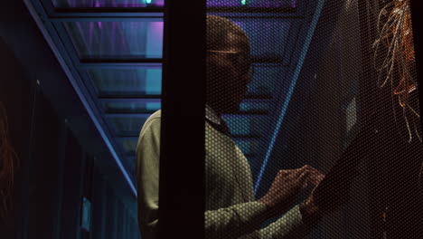IT Specialist Checking on Server Room of Data Center