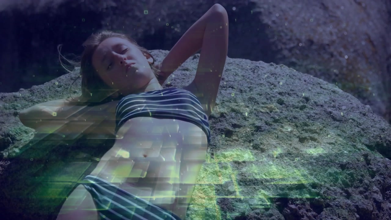 Sunbather lying on rock breathing, green tech overlay mapping breath growing denser then fading