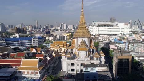 fly up shot of the back of wat traimit temple, golden buddha, bangkok, thailand