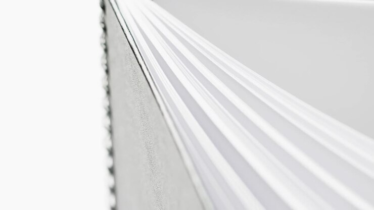 Micro of notebook pages and copy space on white background