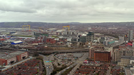 aerial establishing view of belfast city center buzzing with activity as st. patrick's day celebrations continue into the evening hours
