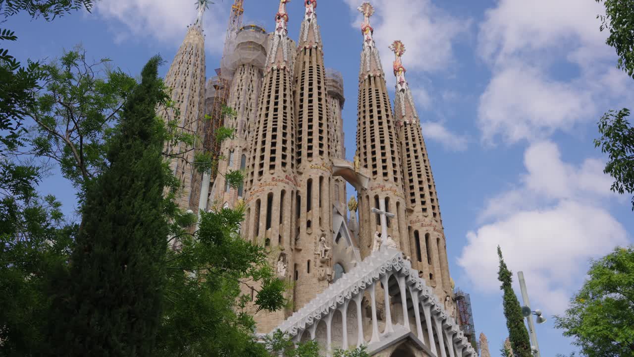 Domes among trees of the Sagrada Familia in Barcelona, Spain