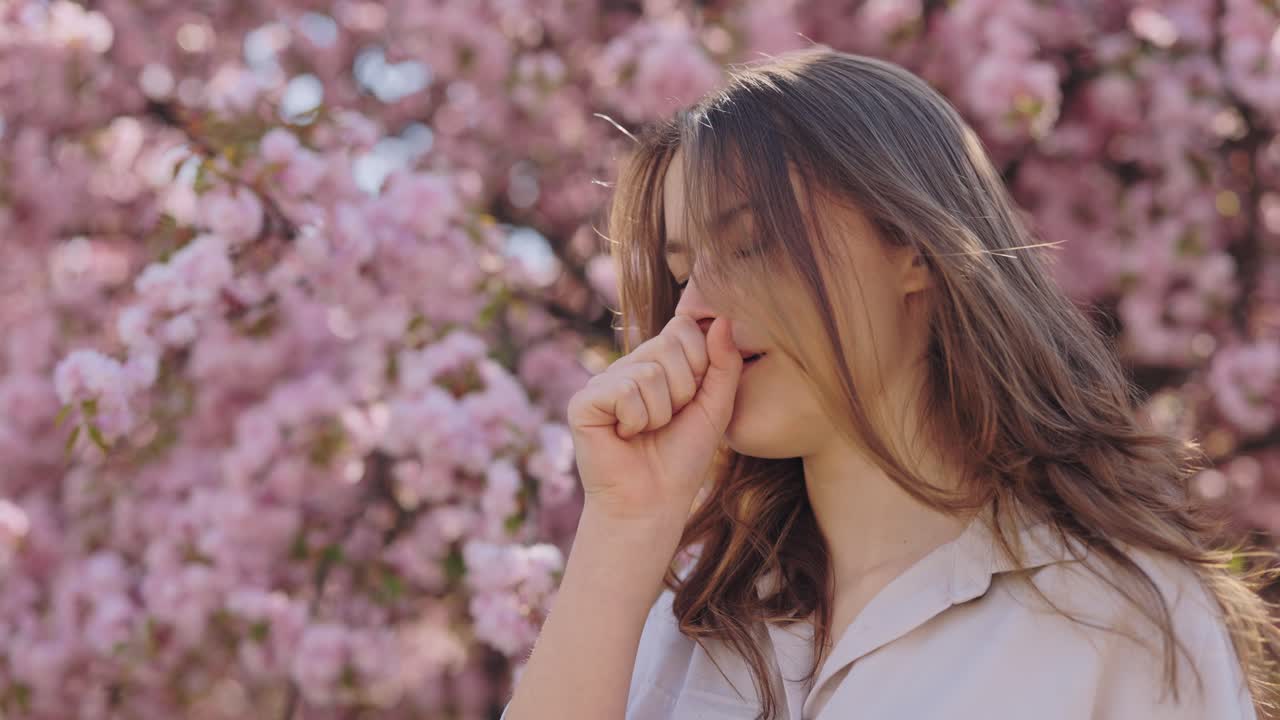 Woman Coughing Under Cherry Blossom Trees