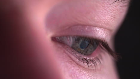 Close-Up-On-Human-Eye-Looking-And-Browsing-A-Smartphone-With-Screen-Reflection---Macro-shot