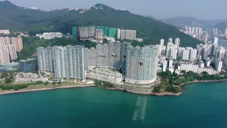 Hong-Kong-Cyberport-waterfront-park-luxury-residential-buildings,-Aerial-view