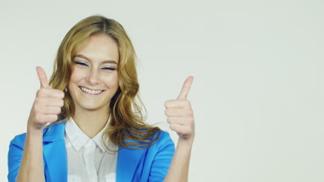 attractive woman showing a thumbs up smiling approval gesture hd video