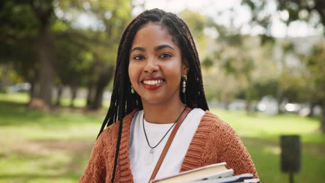 student with books outdoors