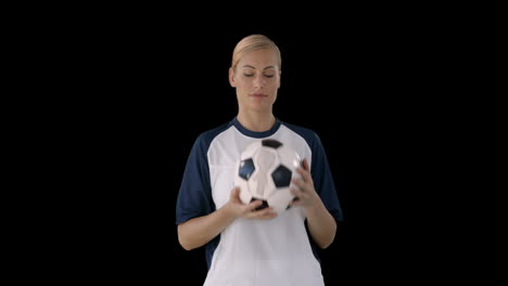 woman juggling a soccer ball