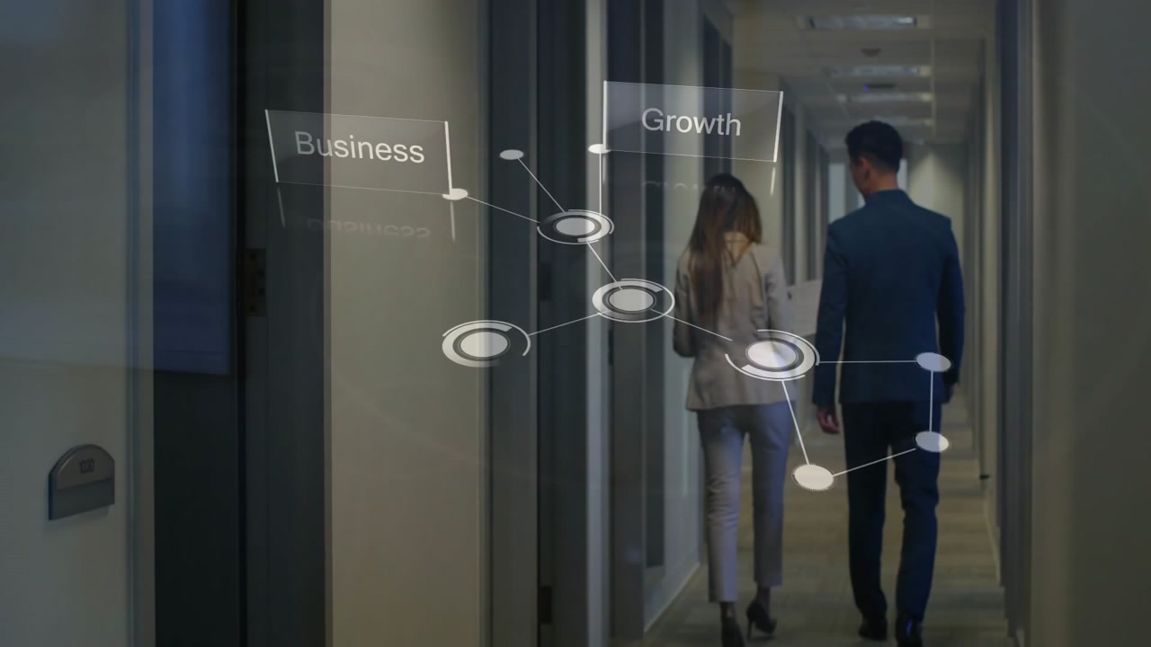 Animation of network of connections with business texts over caucasian colleagues walking in office