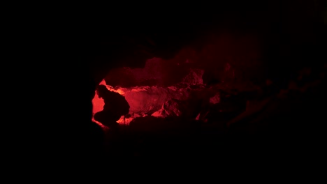 exploring a cave at night with red light