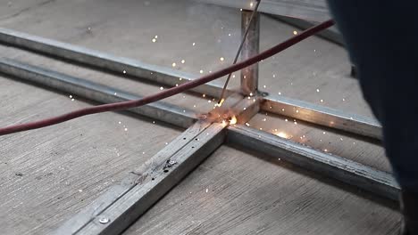 welder man worker welding steel beam structure. industrial hd video