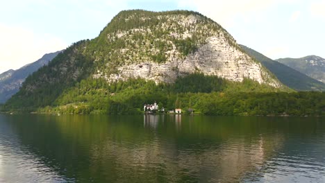 aerial view of hallstatt, austria, captured by drone, showcasing its picturesque lakeside homes, majestic mountains, and the unique charm of this enchanting alpine village