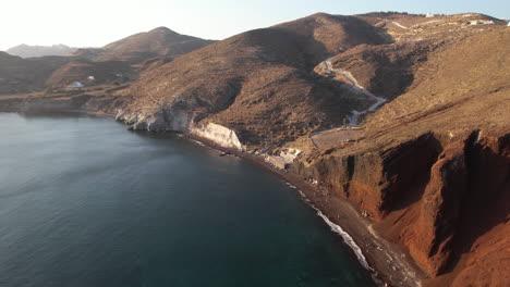 aerial view of red beach and picturesque coastline of santorini island, greece