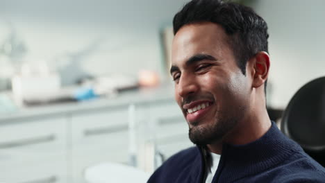 man smiling at the dentist