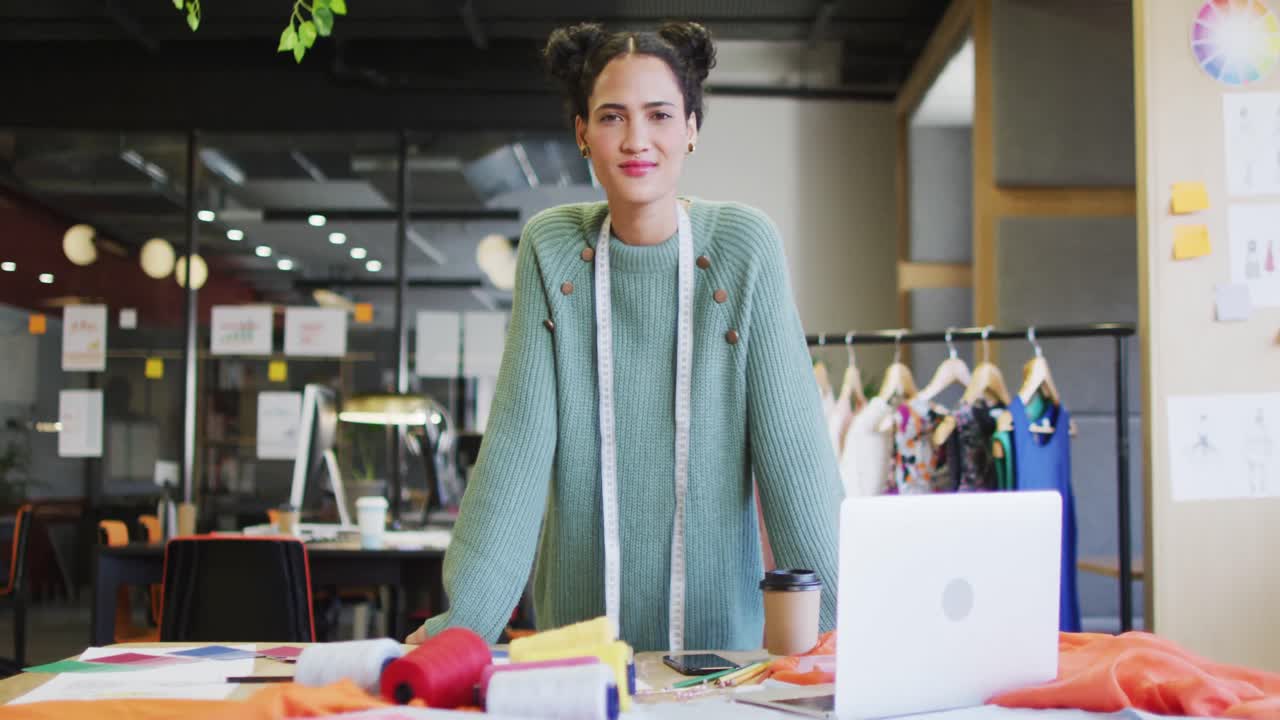Portrait of happy caucasian businesswoman looking at camera at office