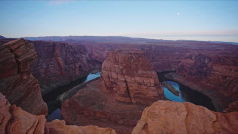 tilt down to river valley with red rock canyon