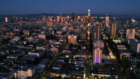 hyperlapse drone shot backwards over the cityscape of san francisco, sunset in usa