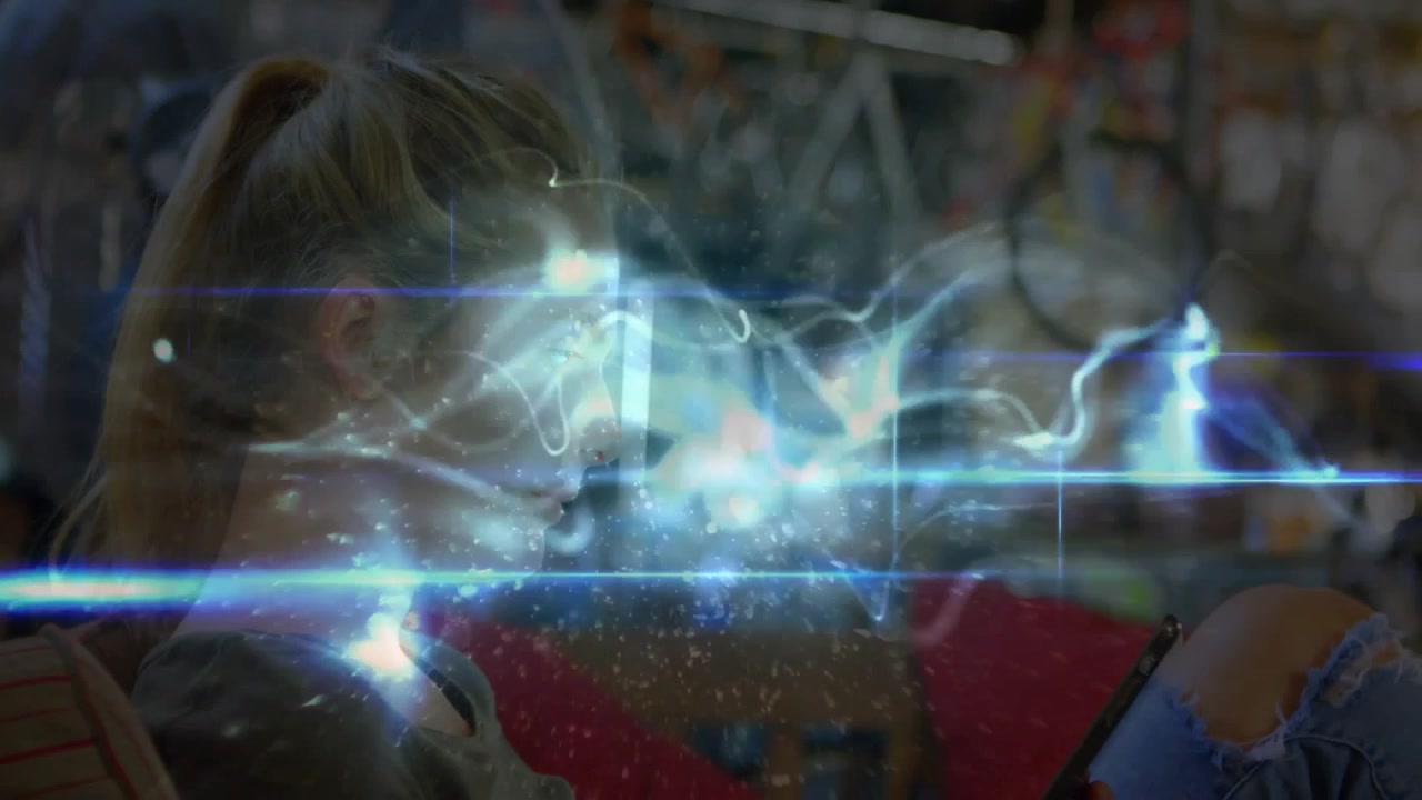 Woman in bike shop seeing energy ribbons swirling and tapping tablet controlling digital currents
